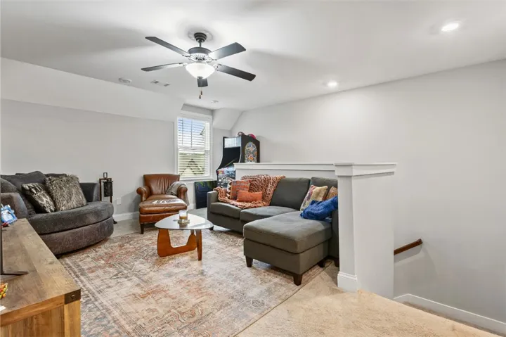 This versatile recreation space features a window for natural light and comfortable seating.