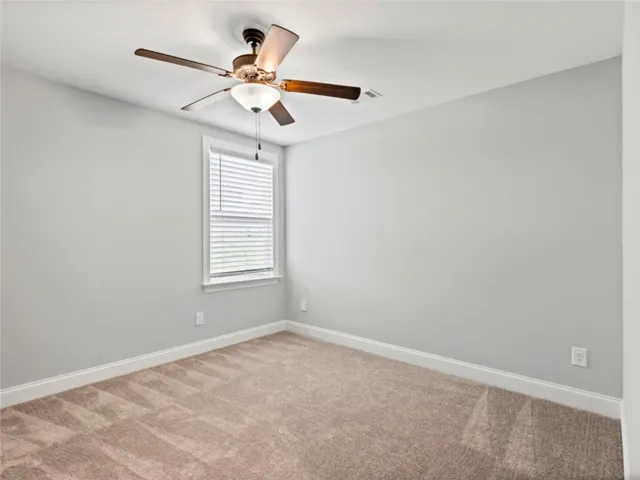 This cozy bedroom offers comfort and a bright atmosphere for peaceful relaxation.