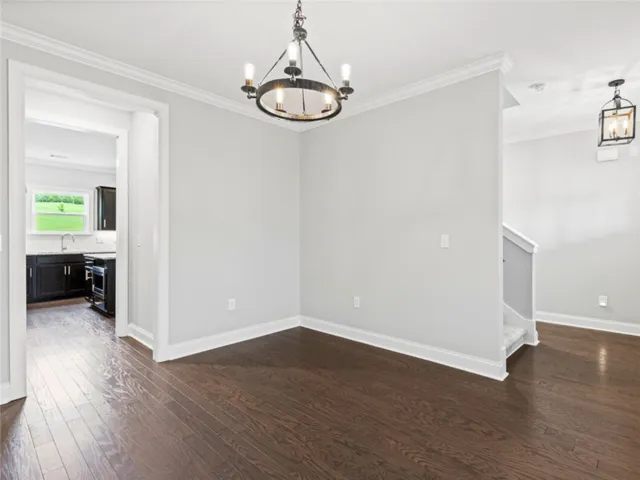 This versatile space features elegant wood flooring, ideal for various living arrangements.