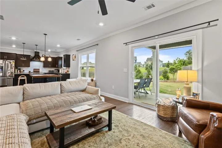 This inviting space seamlessly connects the kitchen and living areas to the outdoors.