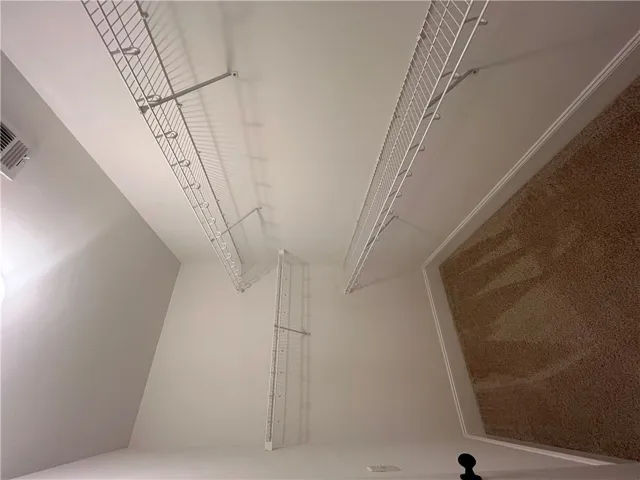 This spacious closet offers organized storage solutions for your wardrobe needs.