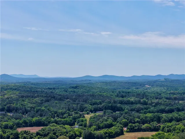 Expansive views stretch across rolling hills, presenting a peaceful and serene environment.