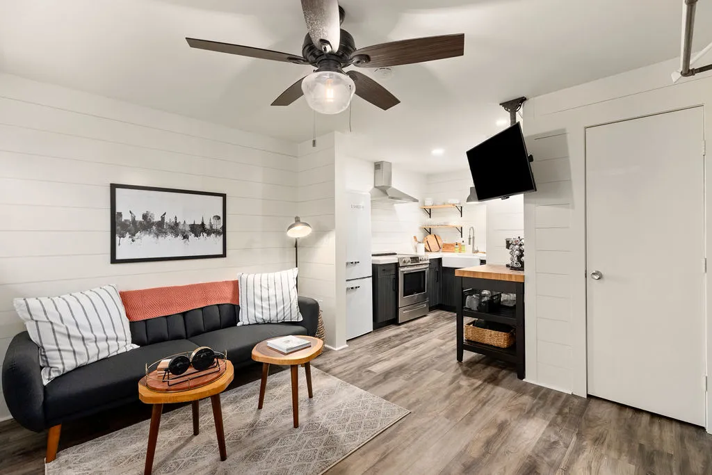 This open-concept living area combines comfort and functionality with a well-appointed kitchen.