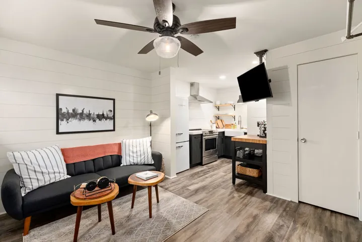 This open-concept living area combines comfort and functionality with a well-appointed kitchen.