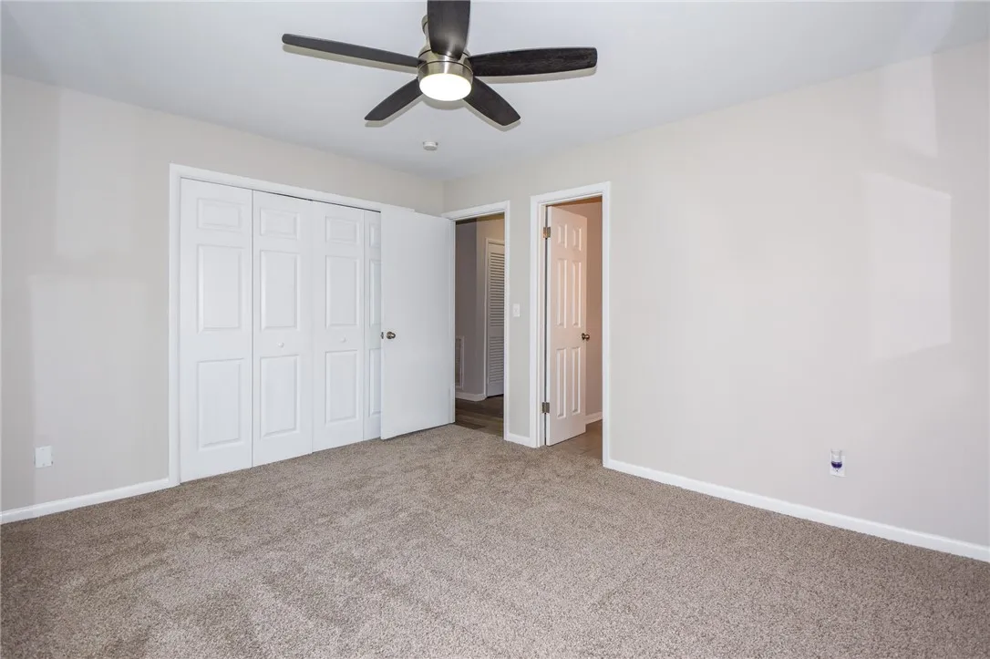 This inviting bedroom offers comfort and a well-maintained interior, perfect for peaceful relaxation.