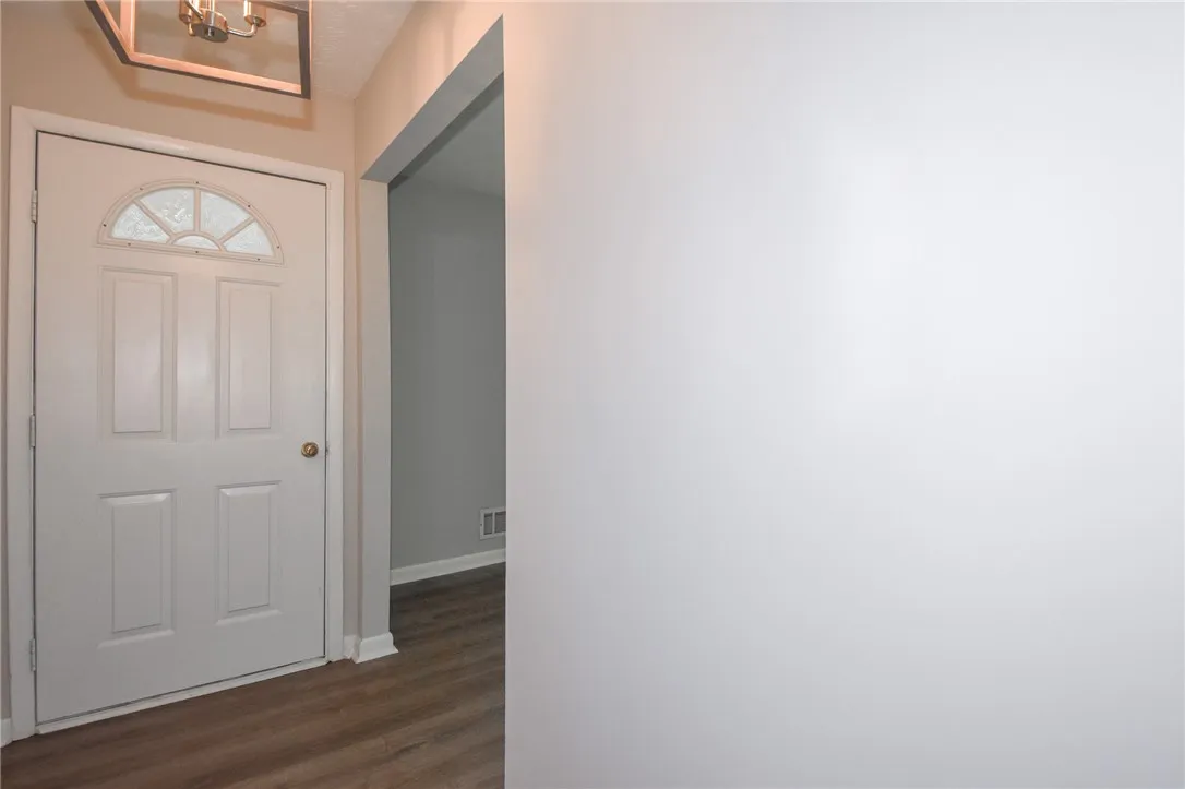 Enter into a welcoming interior featuring durable flooring and an inviting ambiance.