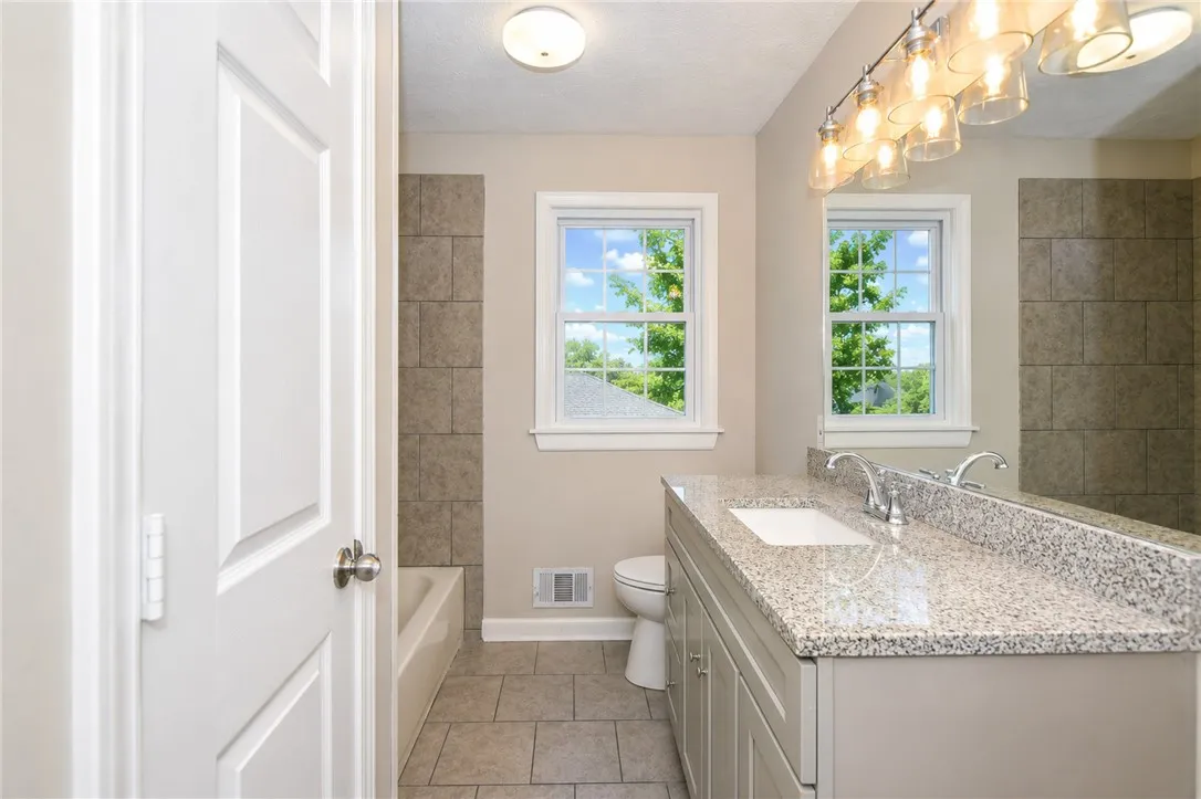 Bright and airy, this bathroom offers a tranquil retreat with ample natural light.
