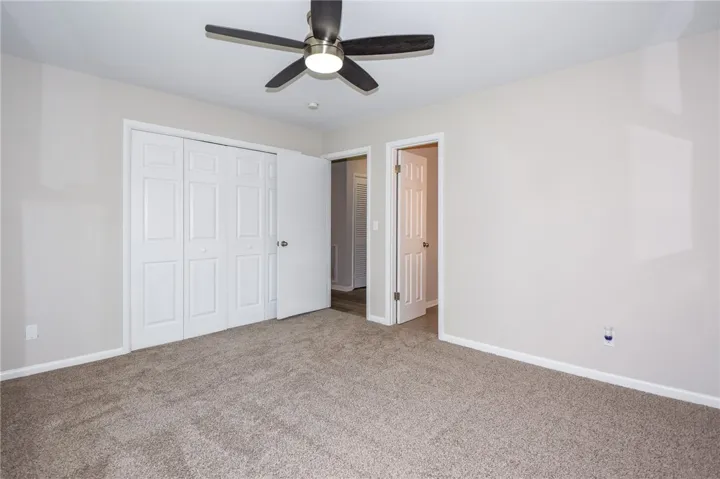 This inviting bedroom offers comfort and a well-maintained interior, perfect for peaceful relaxation.