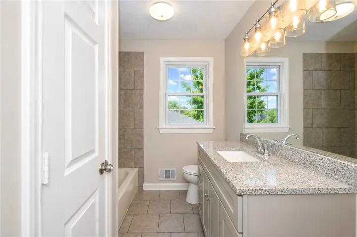 Bright and airy, this bathroom offers a tranquil retreat with ample natural light.