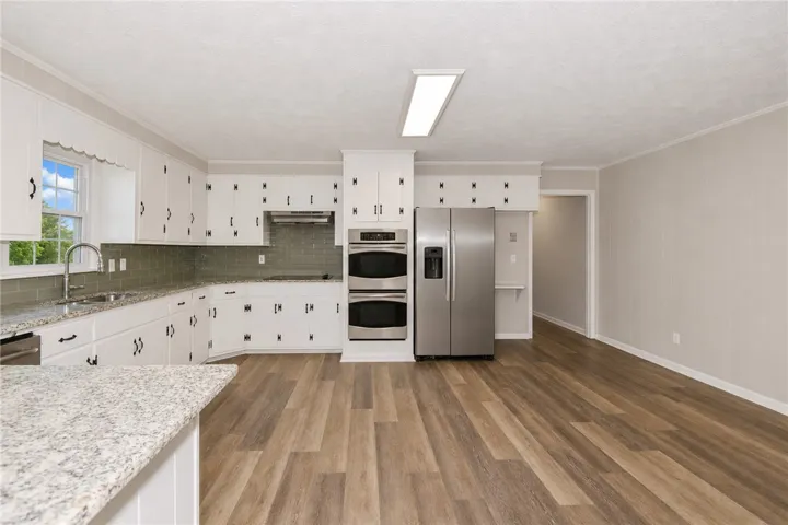 This spacious kitchen offers ample room for culinary endeavors and gatherings.