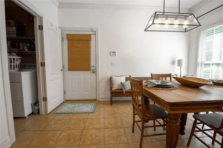 This inviting space combines practicality and comfort, perfect for casual dining and daily routines.