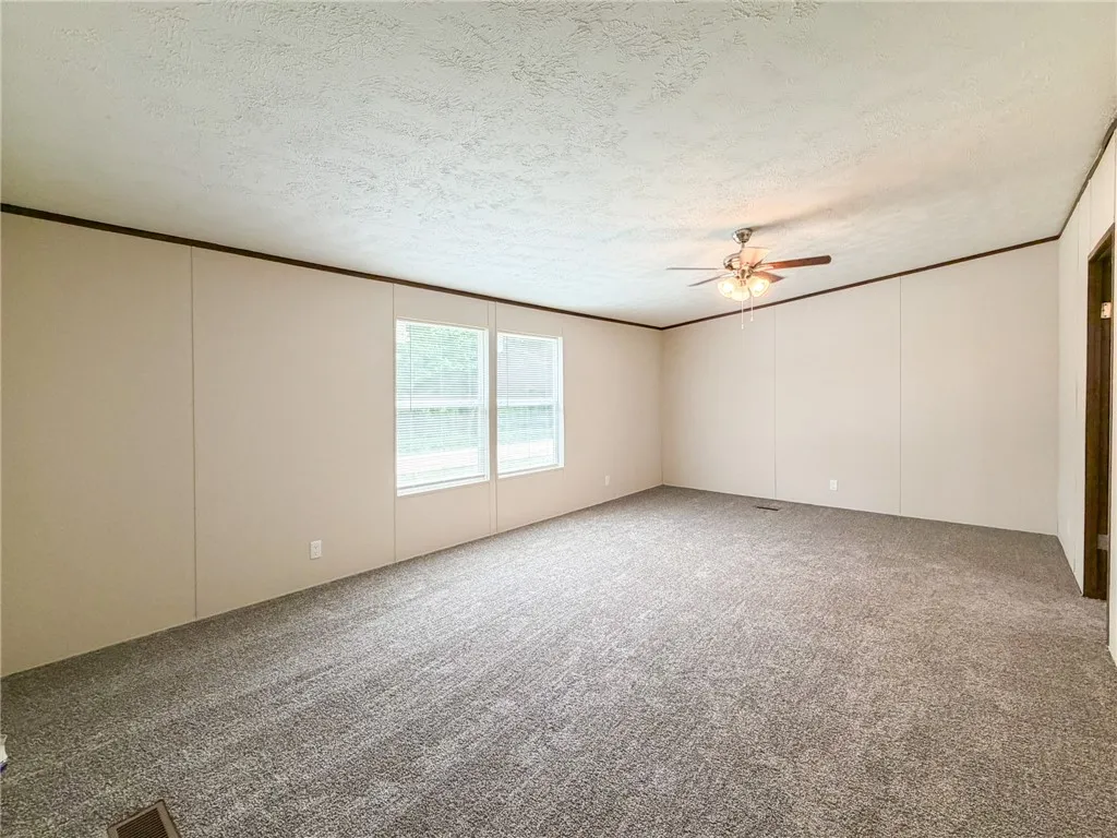 This spacious interior offers an inviting atmosphere with ample natural light.
