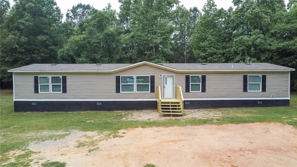 This charming home offers comfortable living with a well-maintained exterior and inviting front entry.