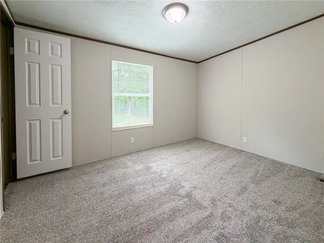 This versatile room offers a neutral palette, ready for personalization.