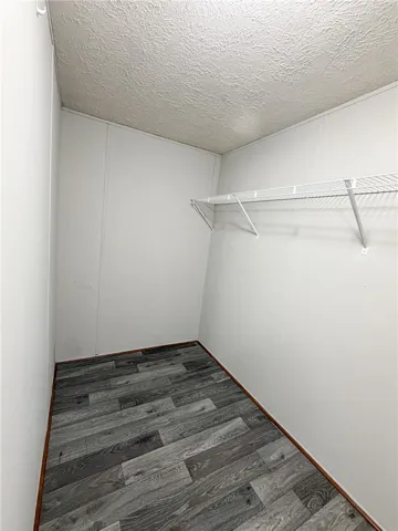 This spacious closet features ample storage solutions and durable flooring.