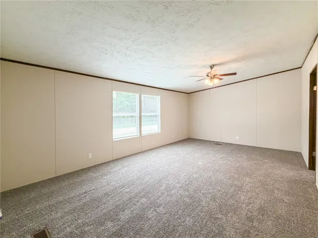 This spacious interior offers an inviting atmosphere with ample natural light.