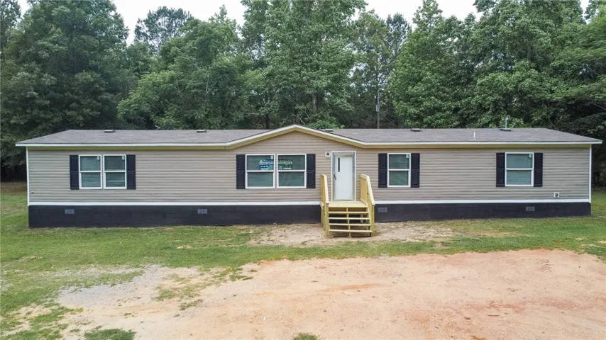 This charming home offers comfortable living with a well-maintained exterior and inviting front entry.