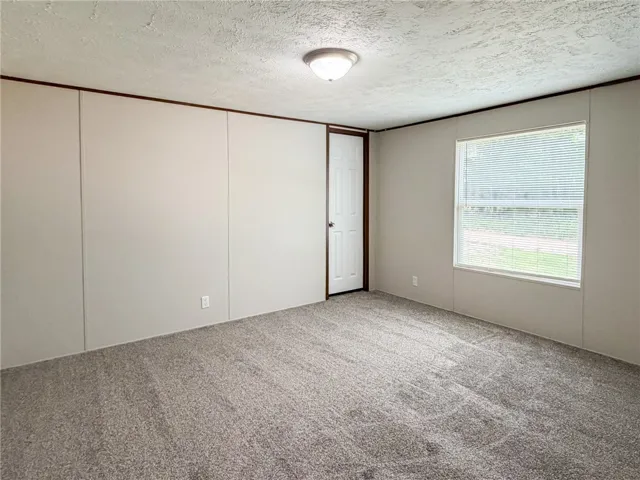 This spacious room offers comfort and versatility for your living needs.