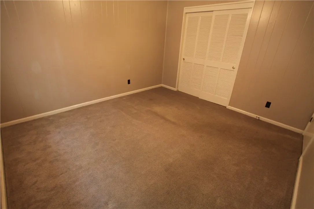 This cozy room offers comfortable carpeting and convenient bi-fold closet doors.