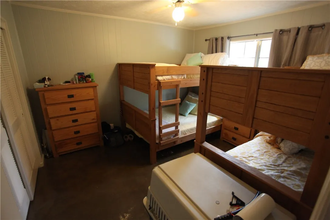 This cozy sleeping space features practical bunk beds and ample storage.