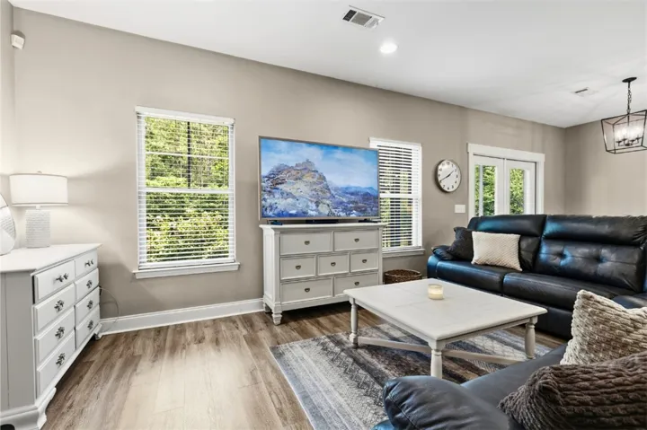 This inviting space features durable flooring and ample natural light, perfect for everyday living.
