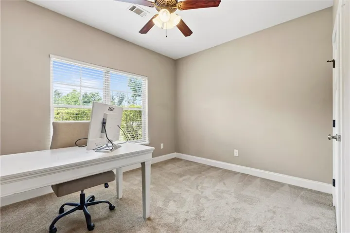 This versatile room offers a quiet retreat for work or study, complete with ample natural light.