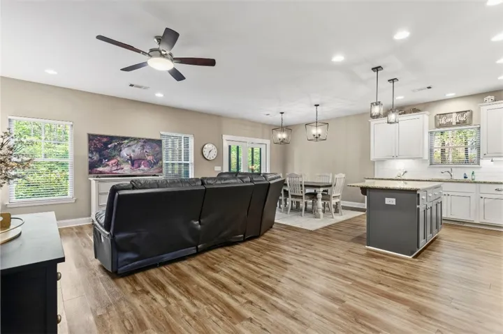 This inviting space offers a comfortable layout, perfect for everyday living and entertaining.