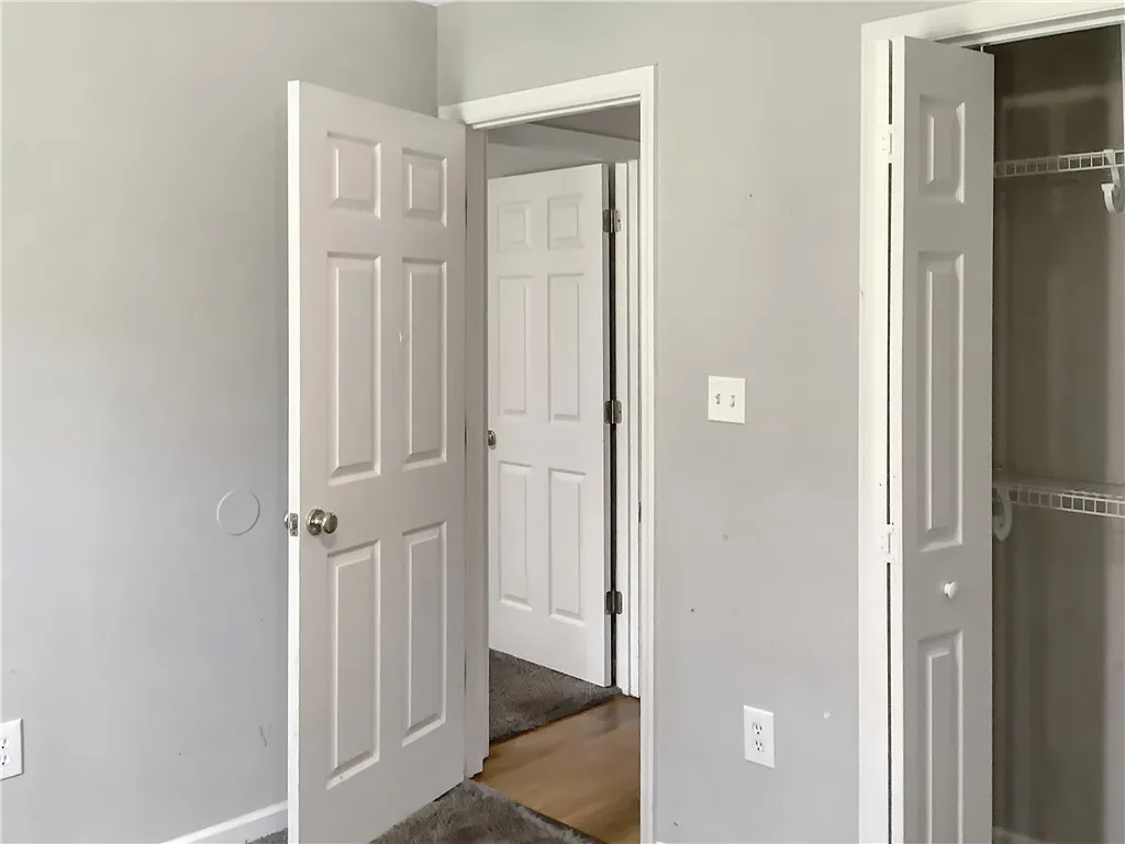 Functional and practical, a closet offers ample storage space for belongings.