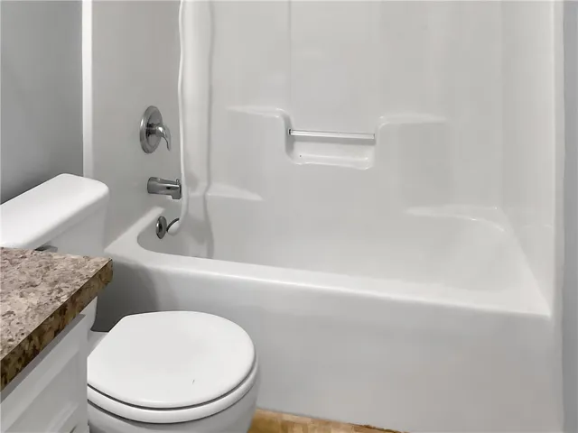A well-maintained tub and shower combination with clean fixtures offers a refreshing start to your day.