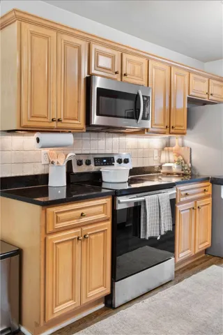 This functional kitchen features ample cabinetry and modern appliances, perfect for everyday living.
