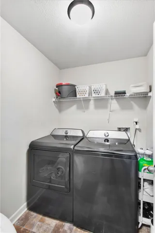 This dedicated laundry space combines practicality and efficiency for daily chores.