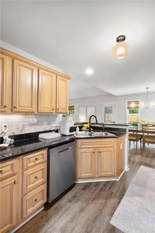 This spacious kitchen offers ample cabinet storage and an open view to the dining area.