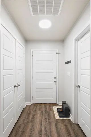 This functional entry offers durable flooring and practical storage solutions for everyday living.