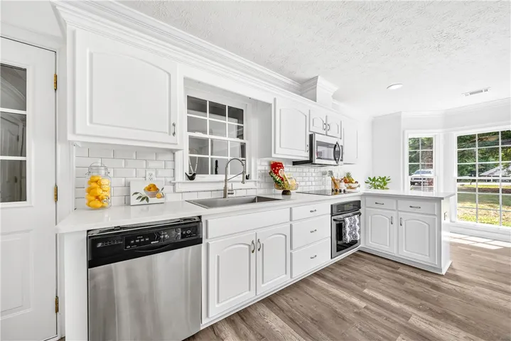 Bright and airy, this kitchen features modern appliances and ample natural light.