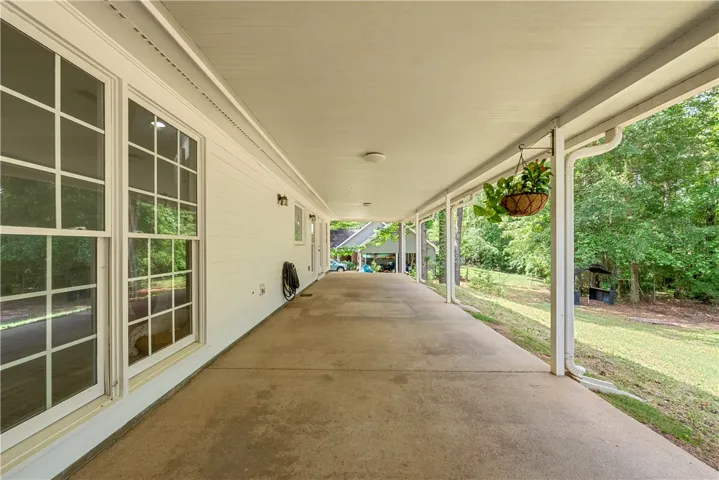 This inviting patio extends living outdoors, perfect for tranquil relaxation and entertaining.