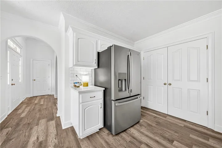 This bright space features sleek appliances and ample storage, perfect for any home.
