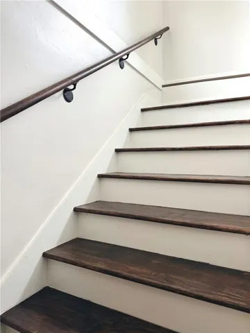 These hardwood stairs feature a simple and elegant design, providing a functional transition between levels.