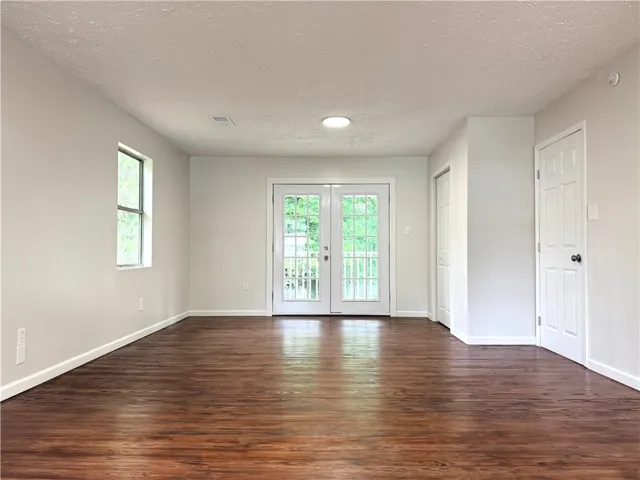 This versatile room offers rich hardwood flooring and abundant natural light.