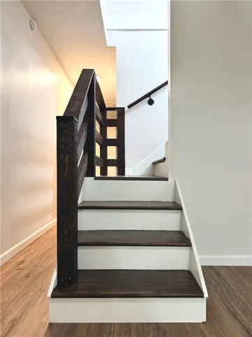 These hardwood stairs and modern railings connect levels with style and functional design.