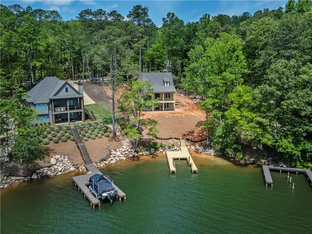 This serene lakeside property offers tranquil waterfront living and captivating natural surroundings.