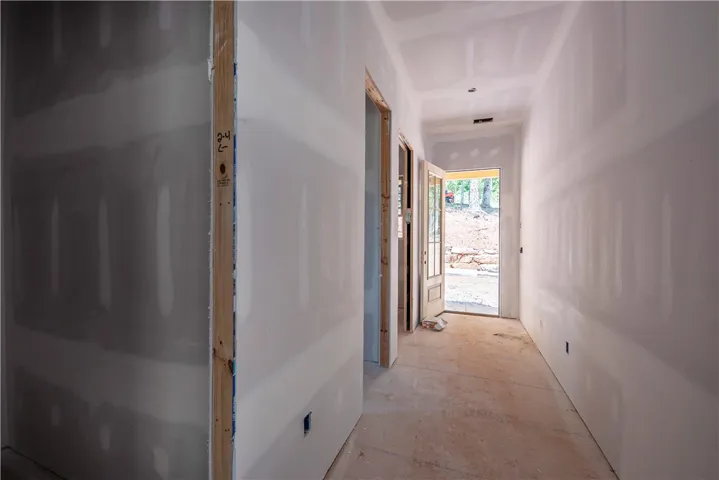 This newly constructed entryway provides a bright and welcoming passage to the outdoors.