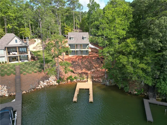 A tranquil lakefront property awaits, offering direct water access and private boat docks.