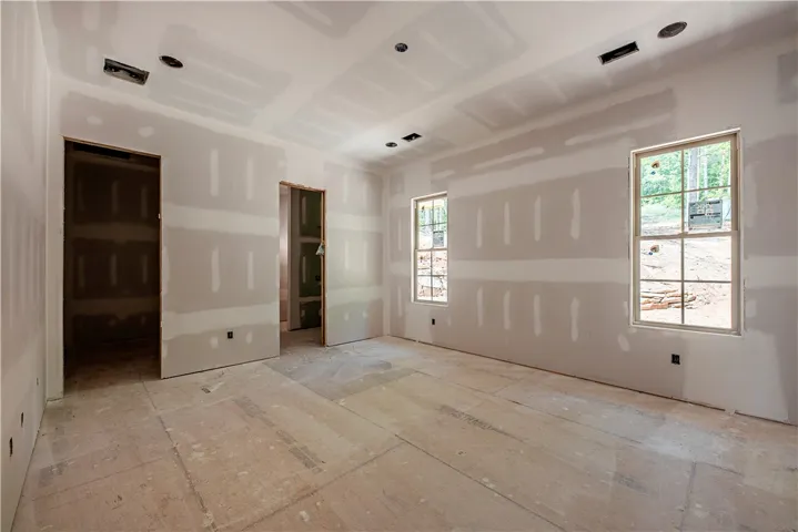This spacious room awaits your personal touch, ready for its final finishes.