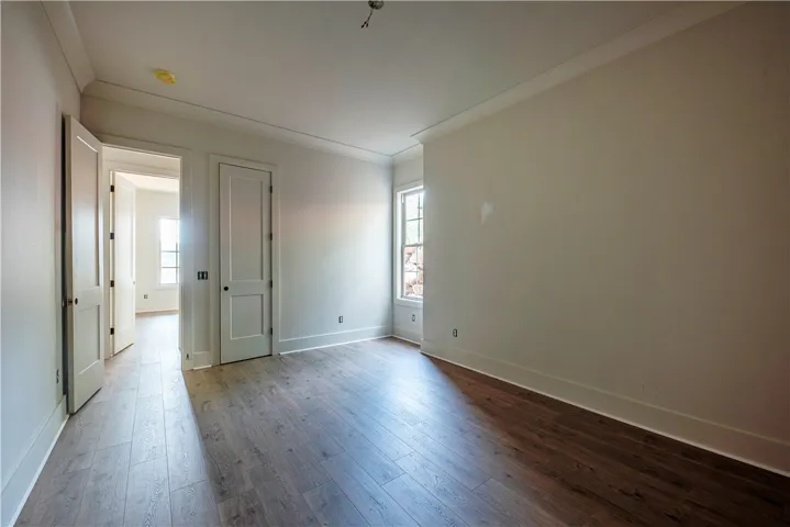 Hardwood floors and generous natural light create an inviting atmosphere within this space.