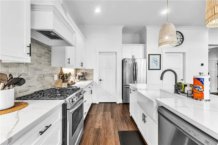 This bright kitchen features sleek appliances and ample counter space for culinary creativity.