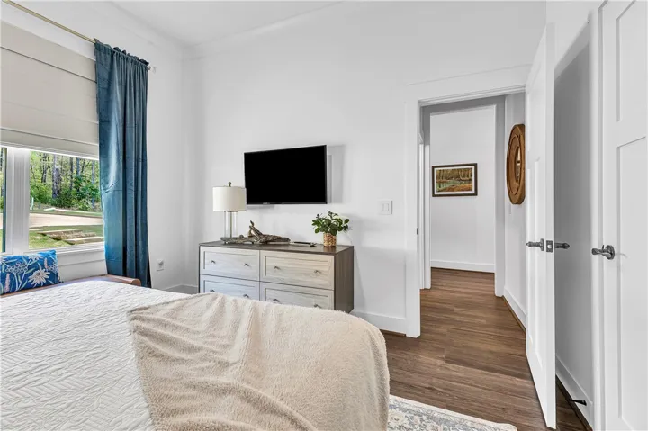 Bright and airy, this tranquil bedroom offers comfortable living with ample natural light.