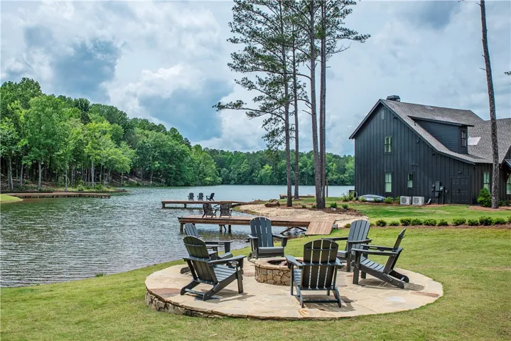 This lakeside home offers expansive water views and a tranquil retreat for outdoor living.