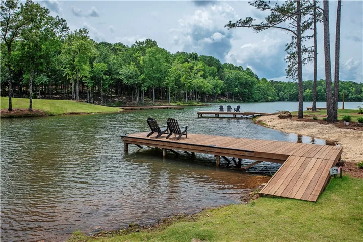 This serene waterfront property offers two private docks, perfect for leisurely lakeside enjoyment.
