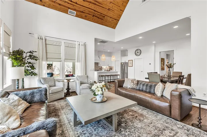 This bright living area features vaulted ceilings and an open floorplan, perfect for modern living.