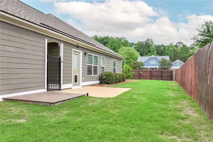 This outdoor space offers a private yard and patio, perfect for relaxation and outdoor enjoyment.